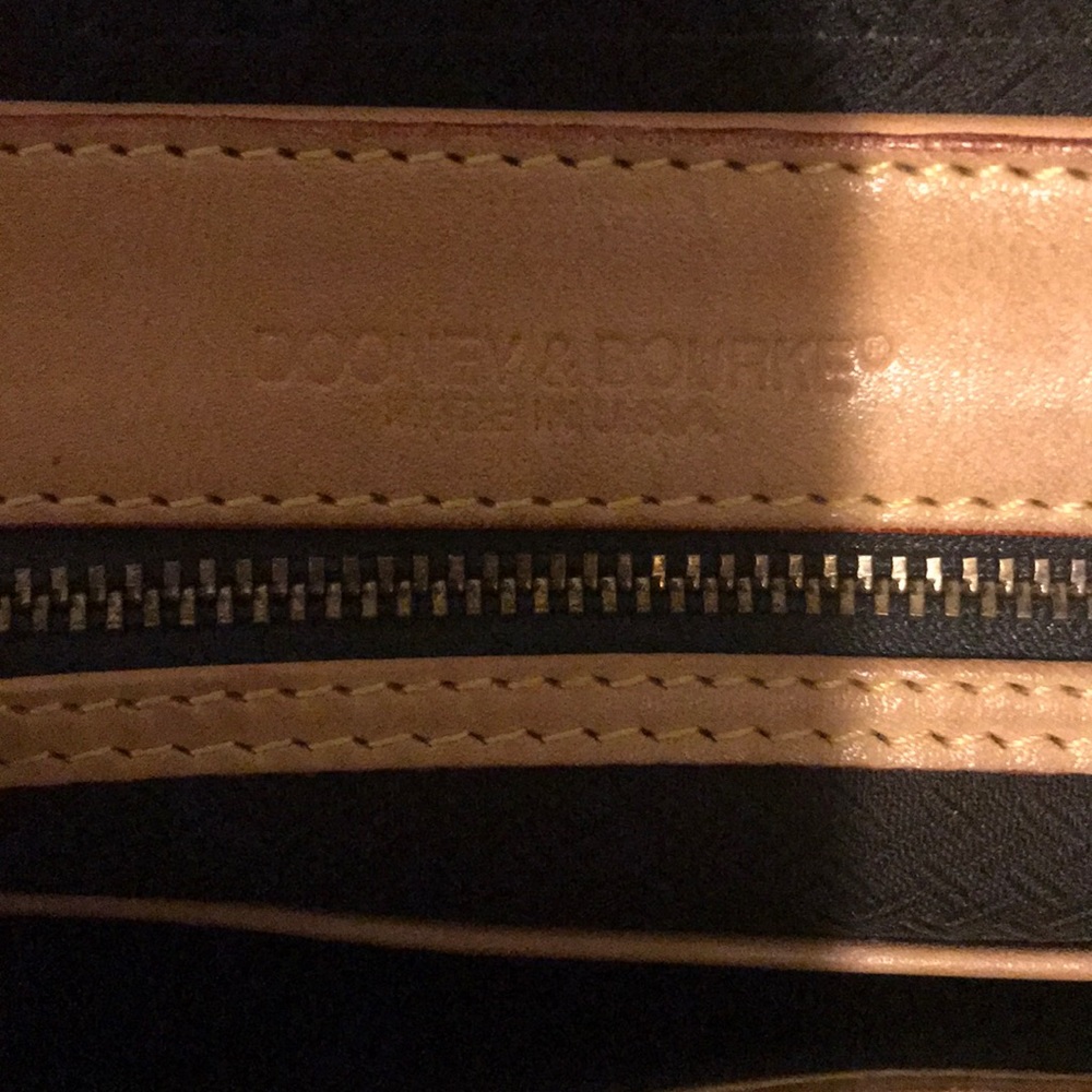 Dooney and Bourke. 100% Genuine leather. Purse